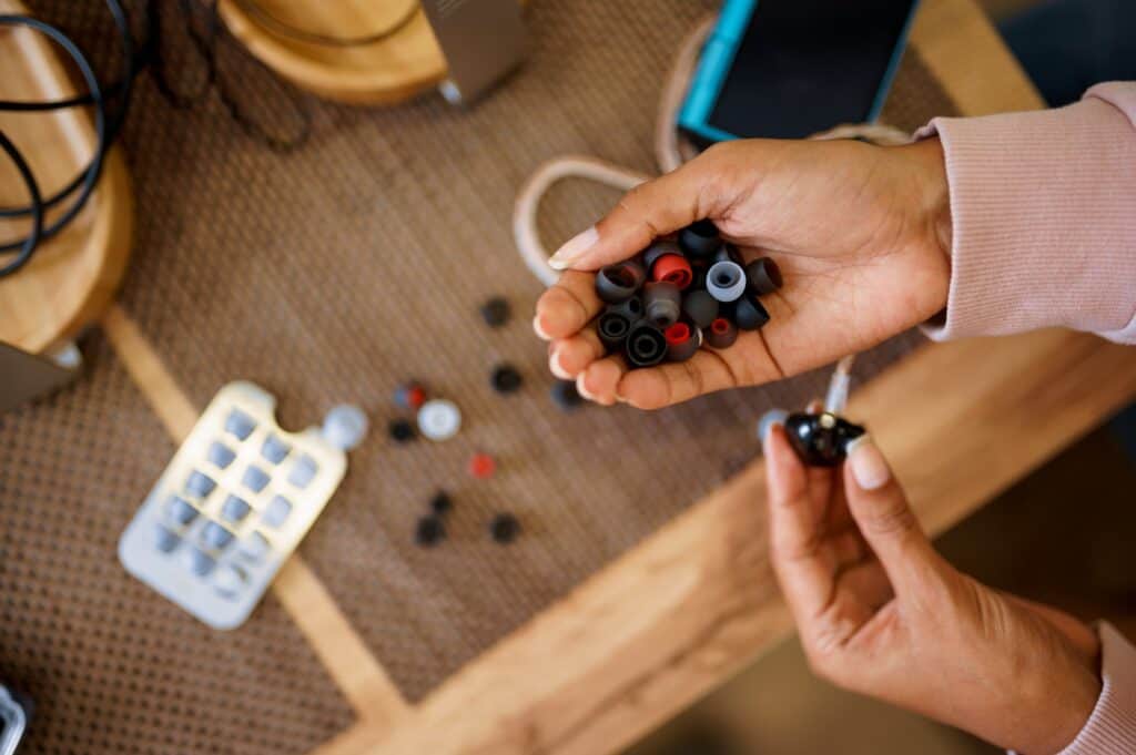 Woman choosing ear pads in audio store