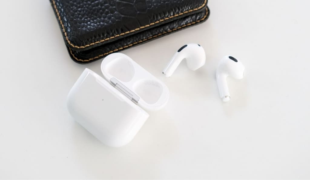 Airpods and wallet on the table