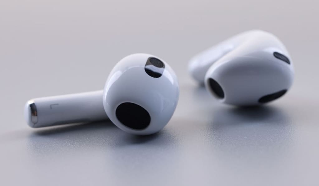 Closeup of new wireless headphones apple airpods 3 on white background