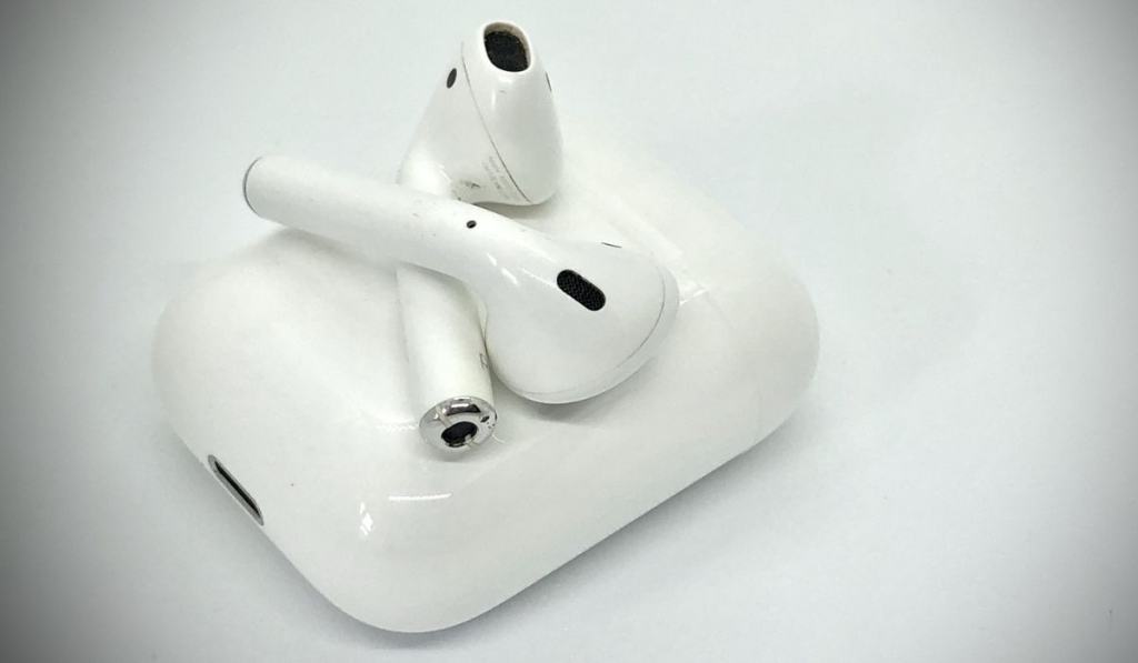 White Wireless Earbuds Out of Charging Case 