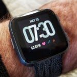 Fitbit Versa smartwatch on a man`s arm