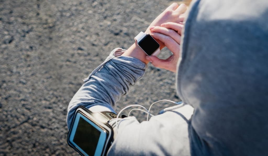 Smartwatch woman athlete using smart watch