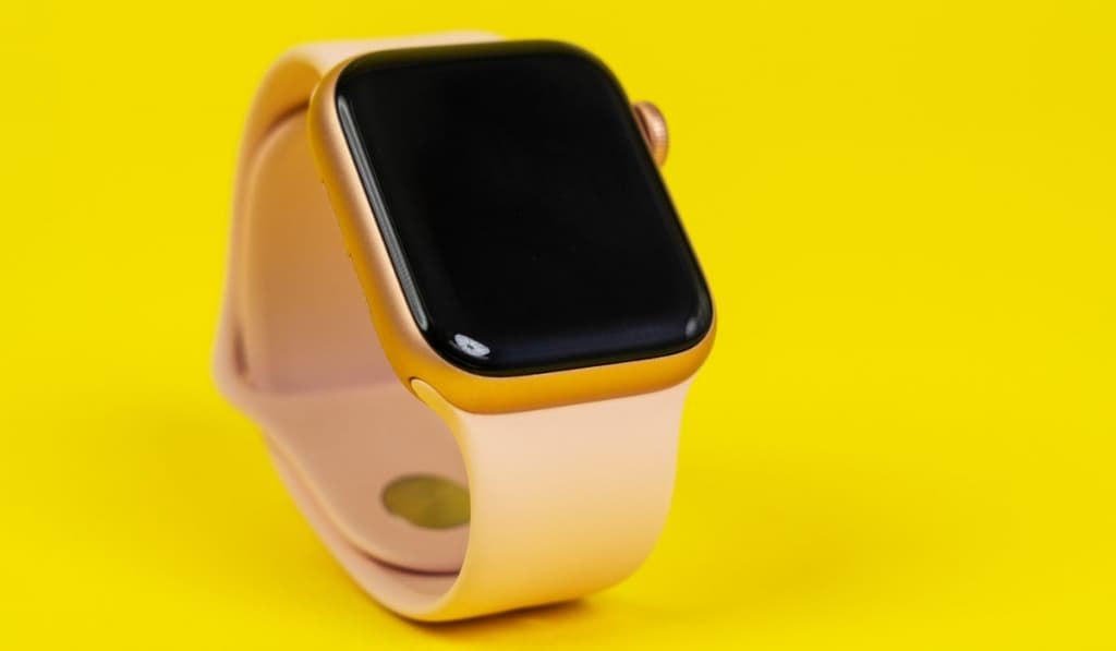 Watch Series 6 with pink rubber strap on yellow background