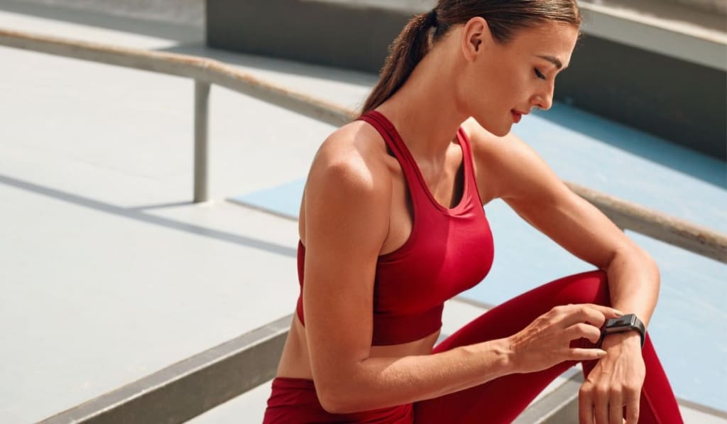 Woman Checking Smart Watch Before Workout