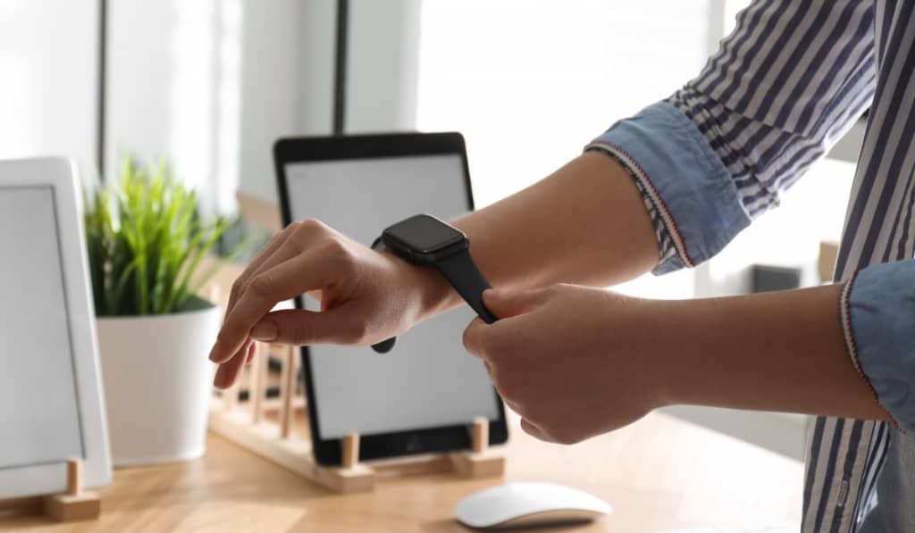 Woman choosing Smart Watch in Apple Store 