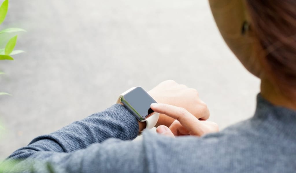 Woman using smart watch on hand new modern lifestyle