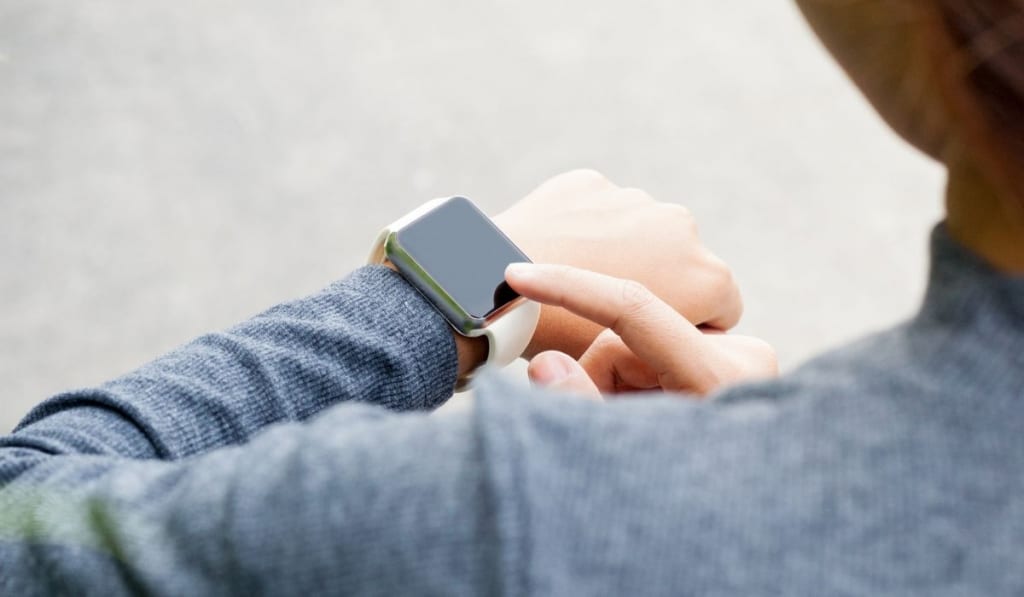 Woman using smart watch on hand new modern lifestyle
