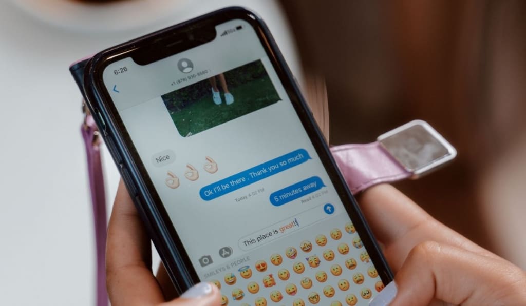 Close-Up Shot of a Person Sending Text Message