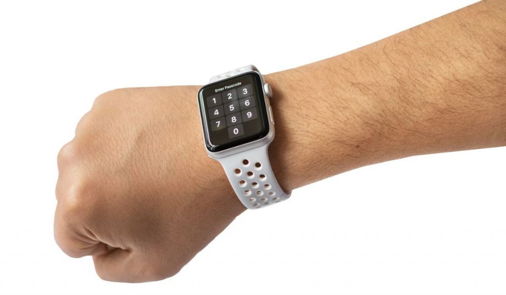 Male hand using with white smart watch