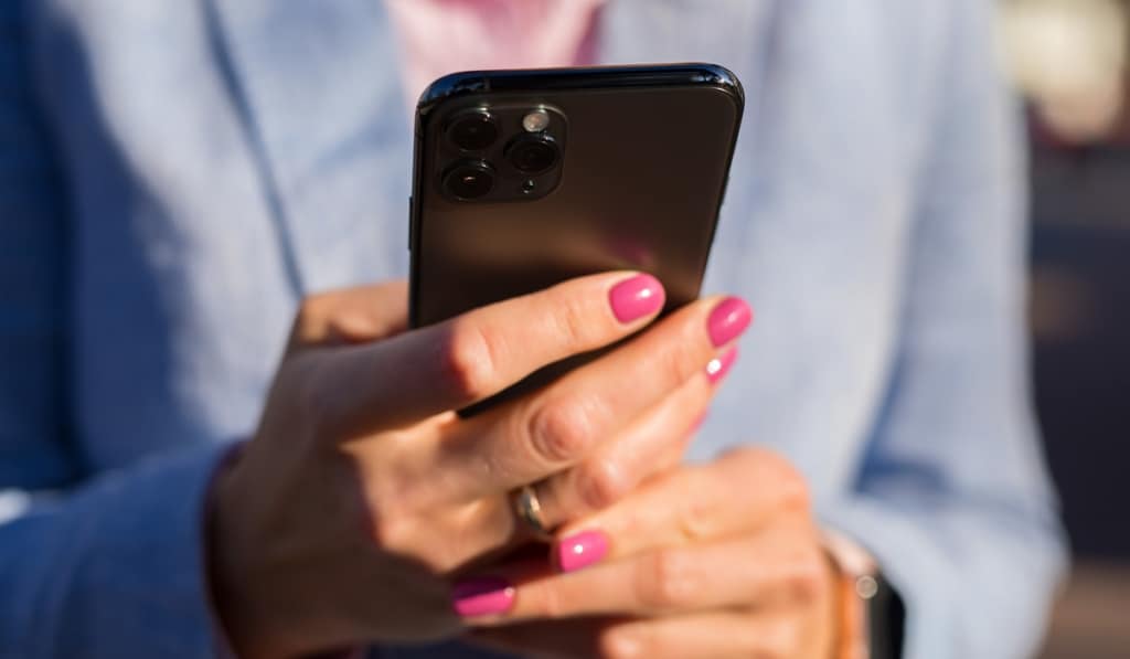 Woman holding an iPhone