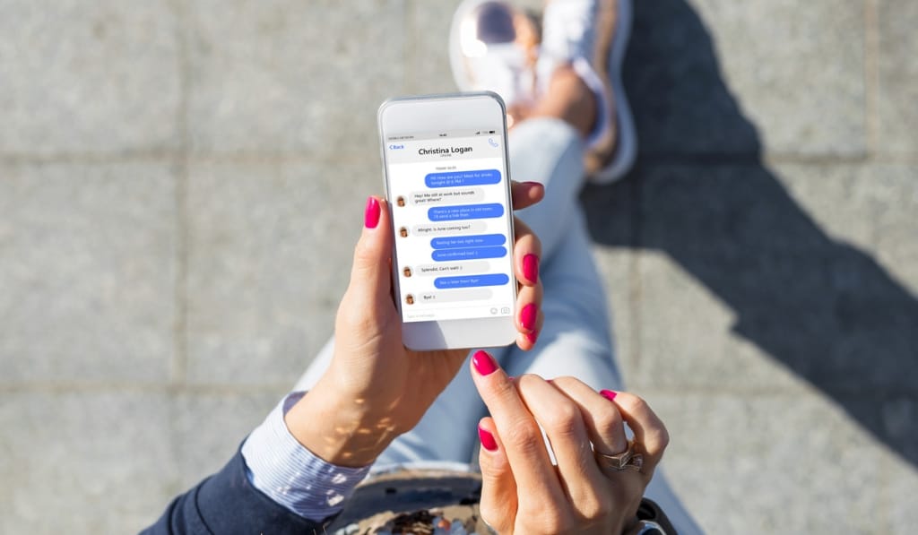 Woman using iMessage on iPhone