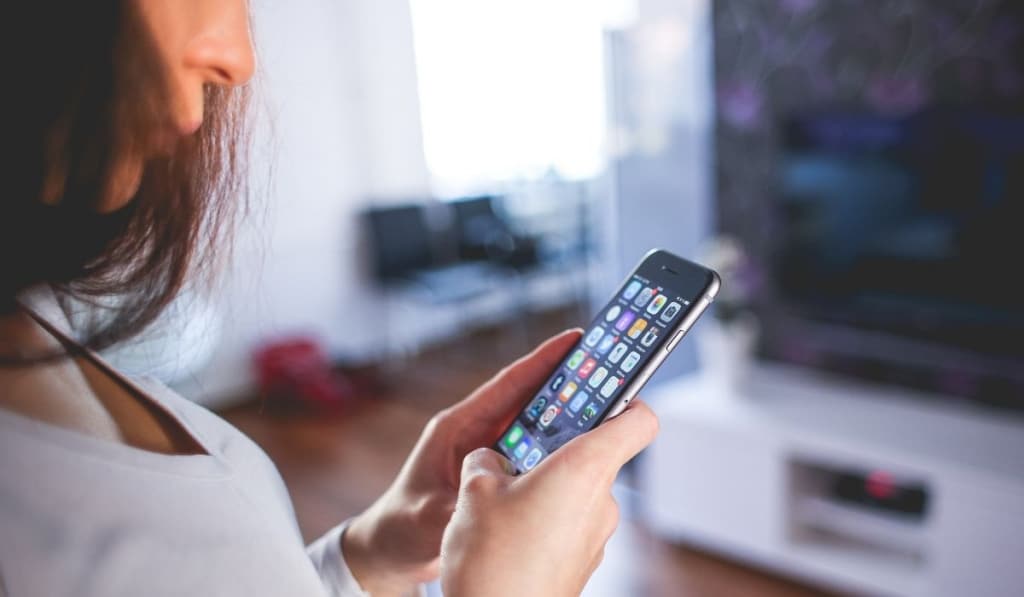 Woman Wearing White V Neck Shirt Using Space Gray Iphone 6