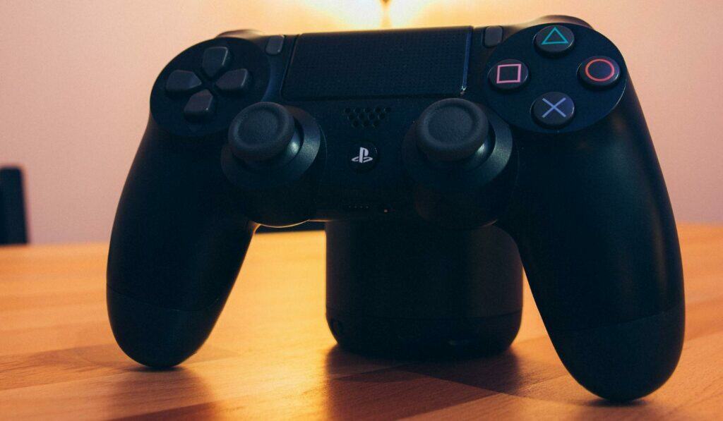 Black Sony Ps4 Dualshock 4 On Tabletop