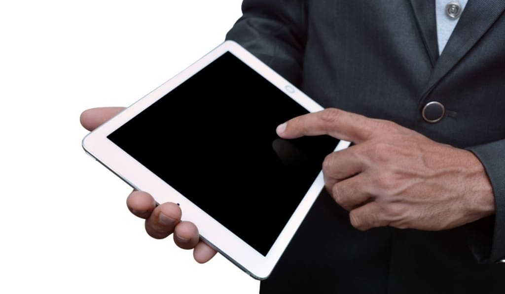 Man holding a tablet computer sideview Smaller 1024x597 1 Control iPad with iPhone?