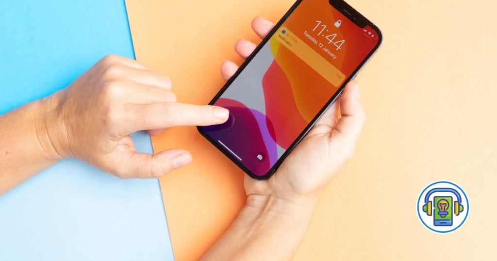 How to Clean iPhone Caches: Simple Steps to Speed Up Your Device and Free Up Space 1 Close-up of hands holding an iPhone with a settings screen, in a clean workspace with a laptop and coffee cup in the background.