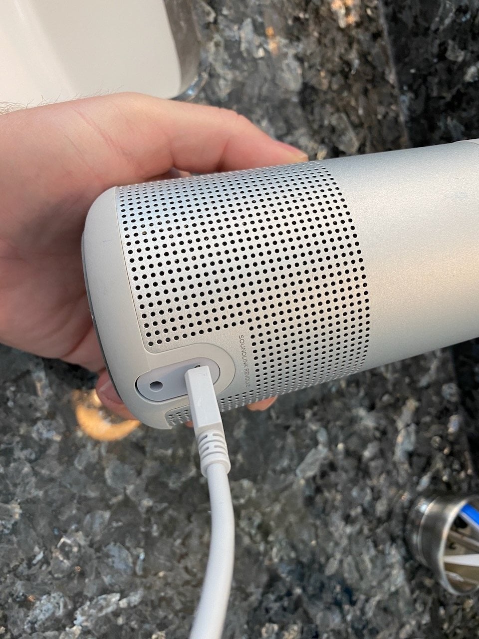 How We Test 2 Plugging in the Bose SoundLink Revolve during testing