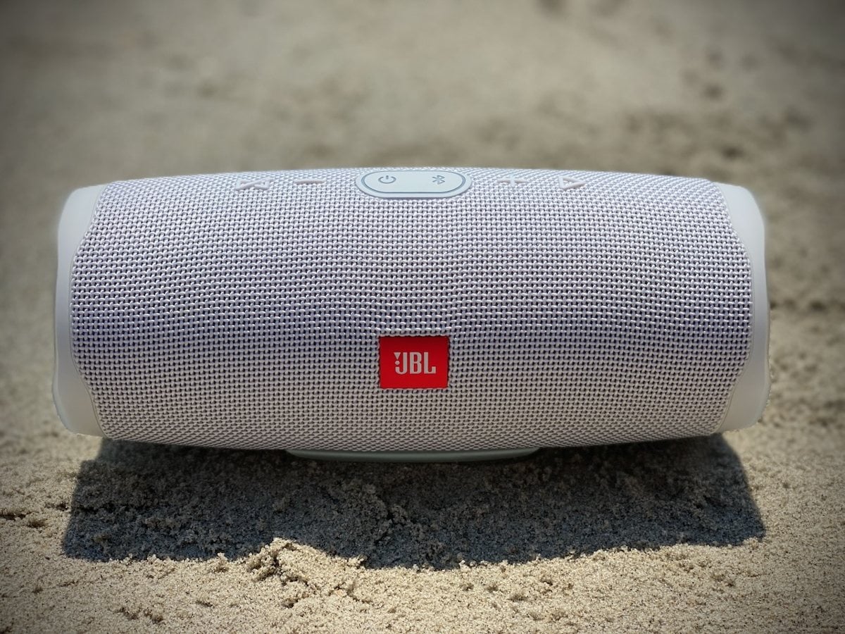 How We Test 1 JBL Charge 4 sitting in beach sand during real world testing